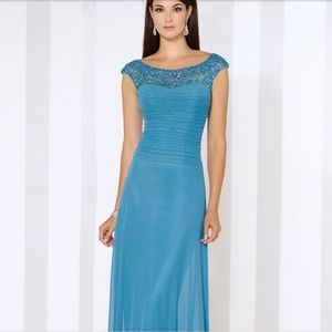 Blue gown with bead embellishment at beach and cap sleeves. Size 12.